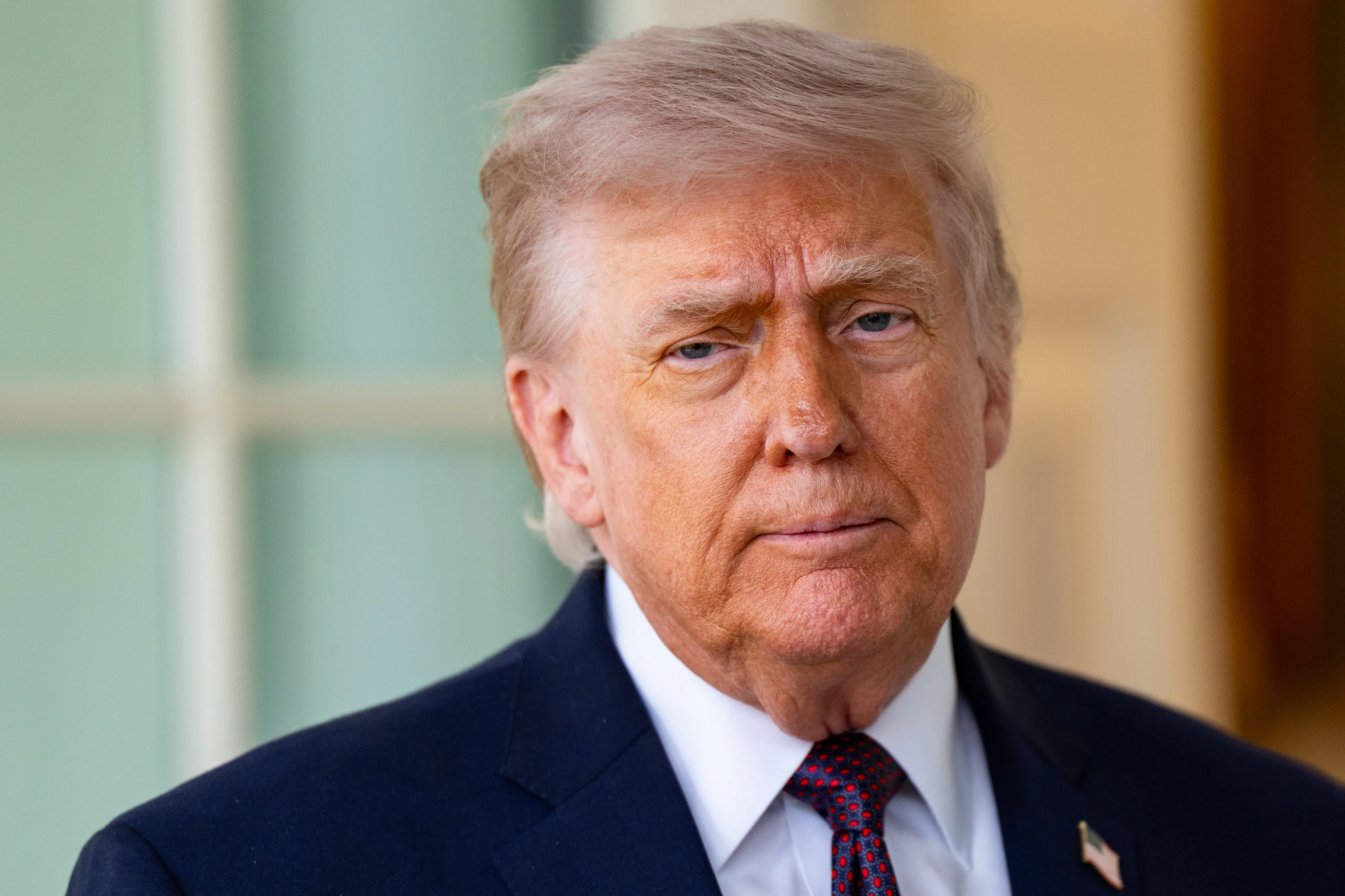 Donald Trump stands outside the Oval Office