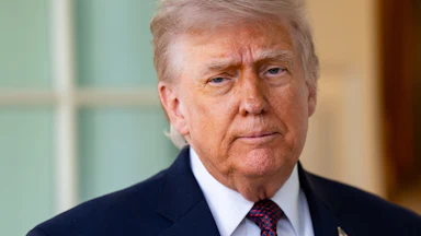 Donald Trump stands outside the Oval Office