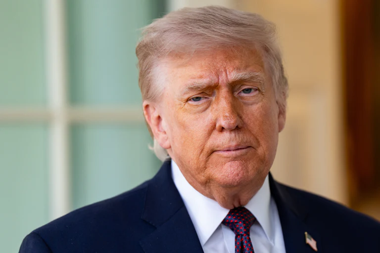 Donald Trump stands outside the Oval Office