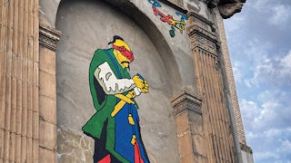 A photo of a mural in Zaporizhzhia, Ukraine, depicts a Cossack flying a drone.