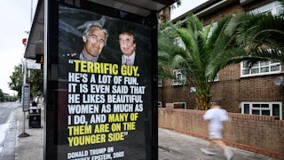 A bus stop in London, England, shows a photo of Jeffrey Epstein and Donald Trump alongside a quote from Trump’s birthday note to Epstein