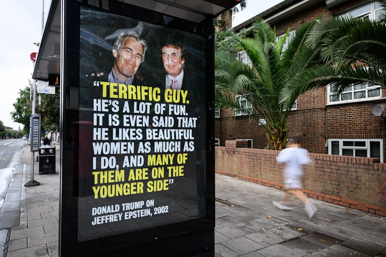 A bus stop in London, England, shows a photo of Jeffrey Epstein and Donald Trump alongside a quote from Trump’s birthday note to Epstein