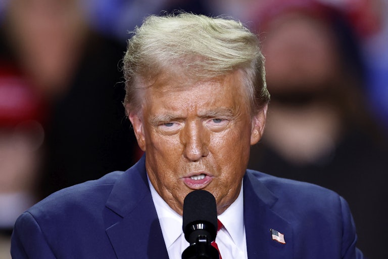 Donald Trump speaking at a mic