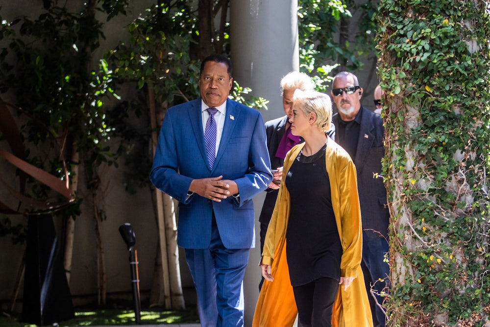 Larry Elder and actress Rose McGowan at a press conference