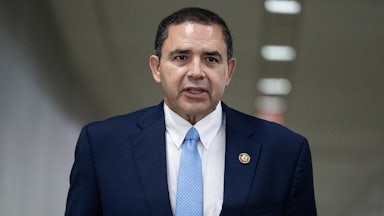 Rep. Henry Cuellar speaks at a meeting.