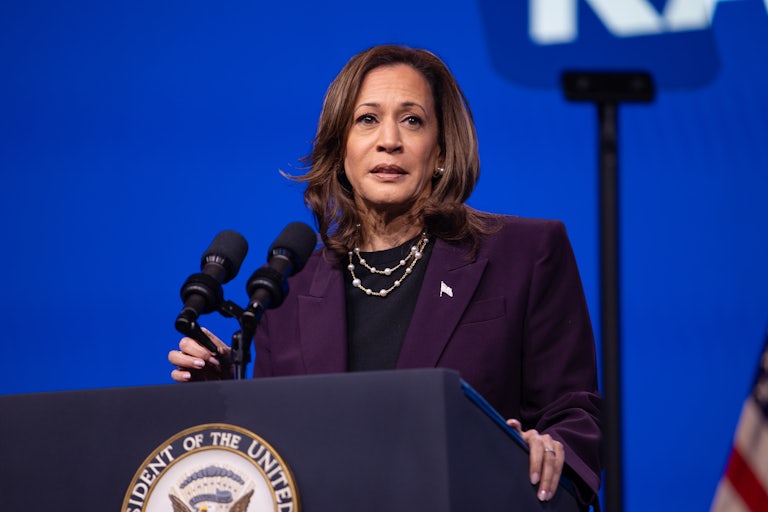 Kamala Harris stands at a lectern