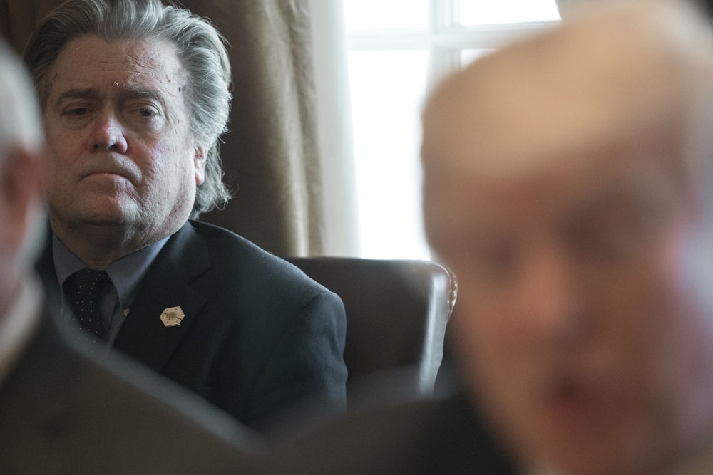 Steve Bannon listens to Trump at a Cabinet meeting