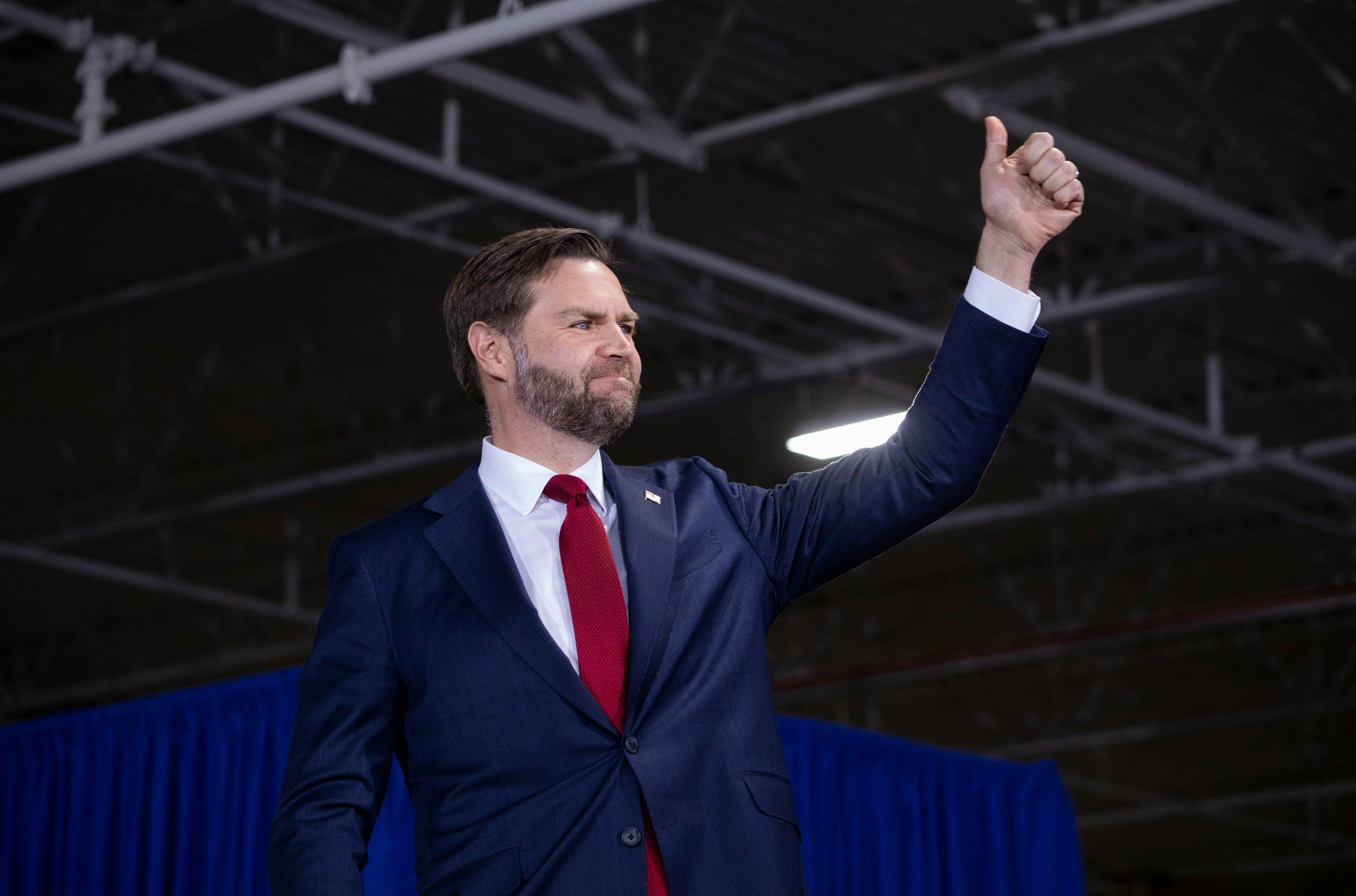 JD Vance gives a big thumbs up and smiles