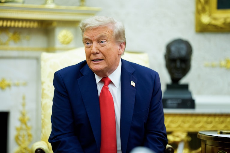 Donald Trump makes a face while sitting in the Oval Office.