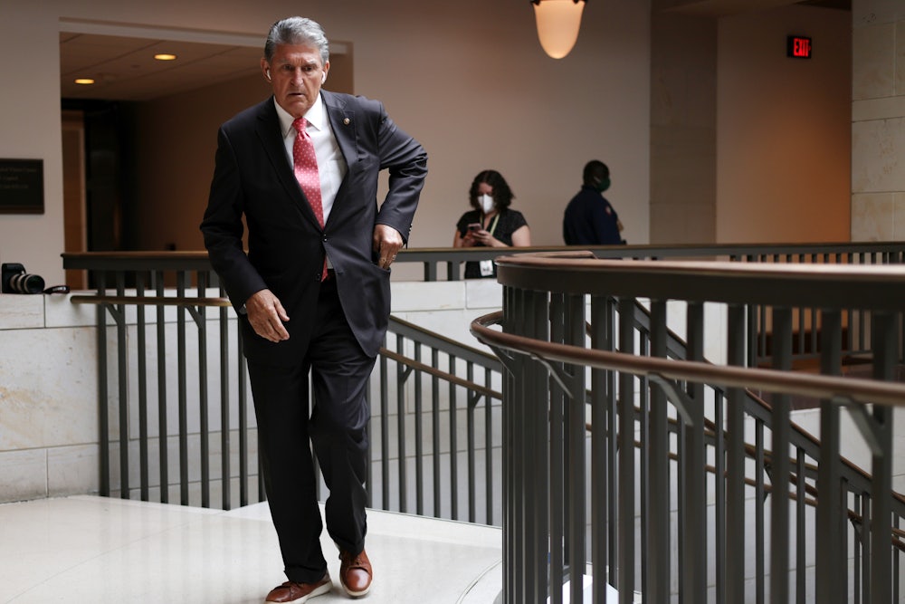 Joe Manchin reaches into his pocket.