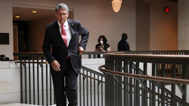 Joe Manchin reaches into his pocket.