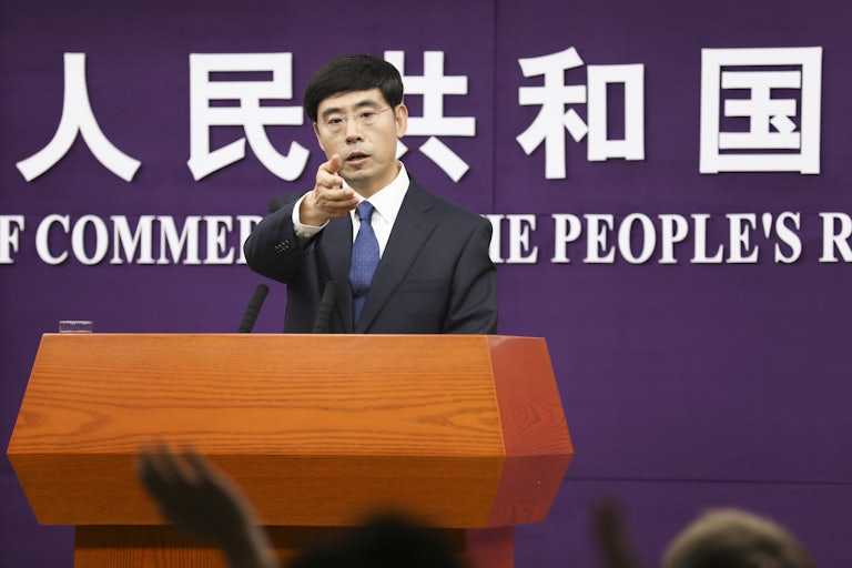 China's Commerce Ministry spokesperson He Yadong speaks during a press conference.