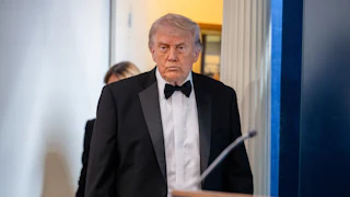 Donald Trump purses his lips while walking into the White House press briefing room