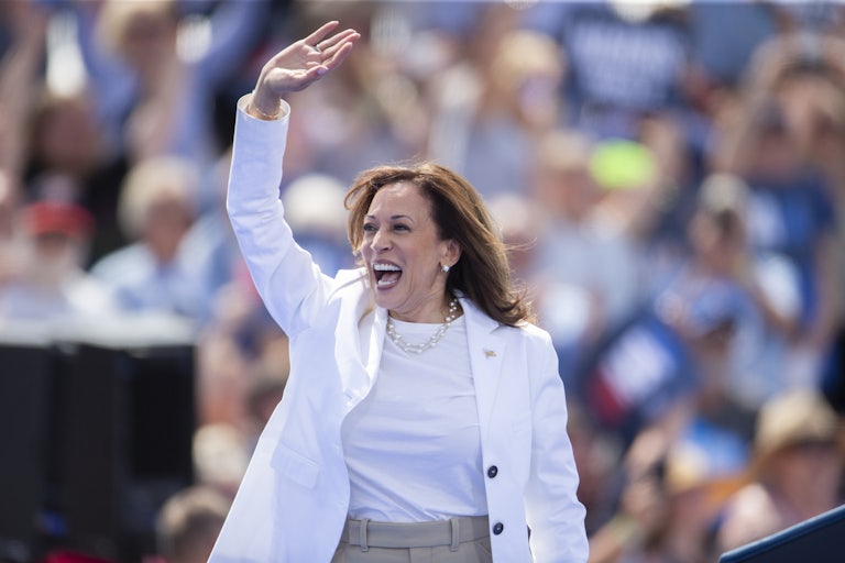 Kamala Harris waves at a campaign event