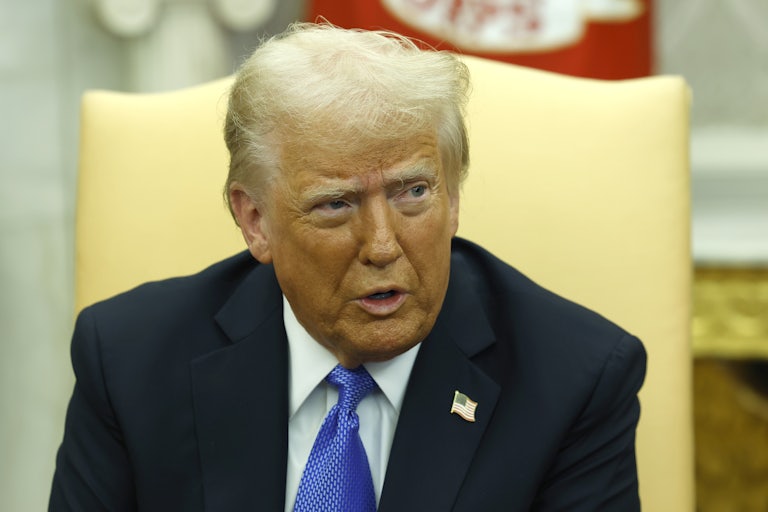 Donald Trump speaks in the Oval Office. (His spray tan looks especially bad.)