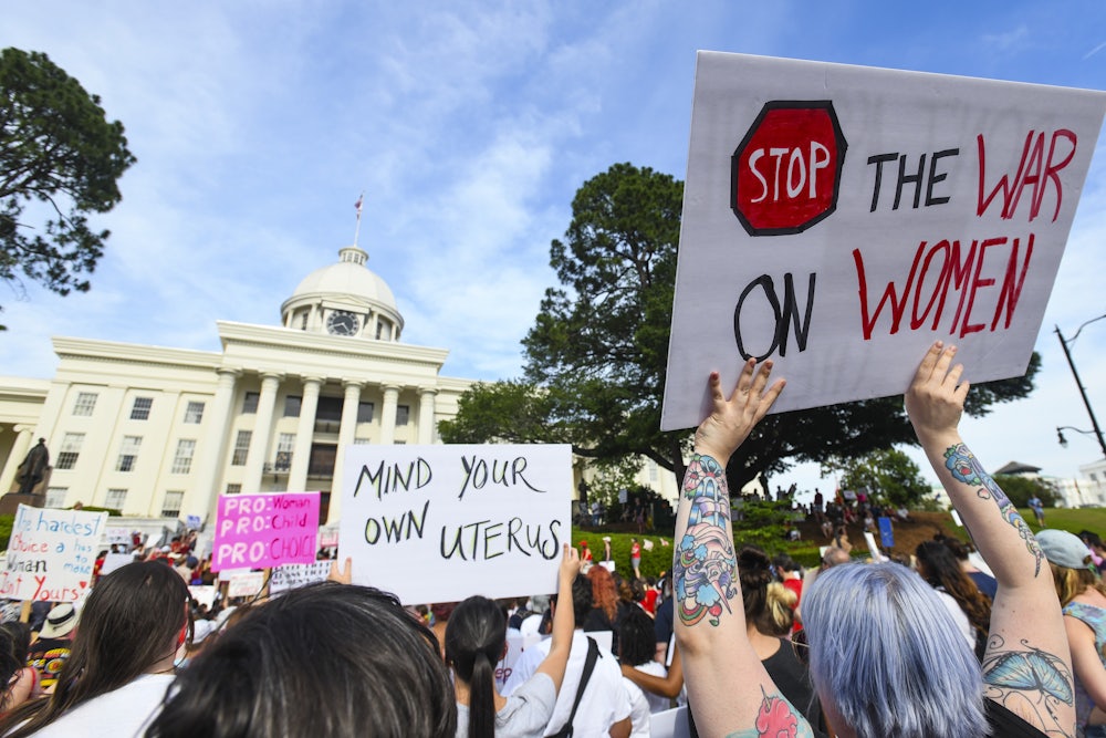 Demonstrators participate in a 2019 rally against restrictive bans on abortions outside the Alabama statehouse.