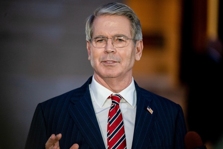 Treasury Secretary Scott Bessent gestures while speaking to reporters