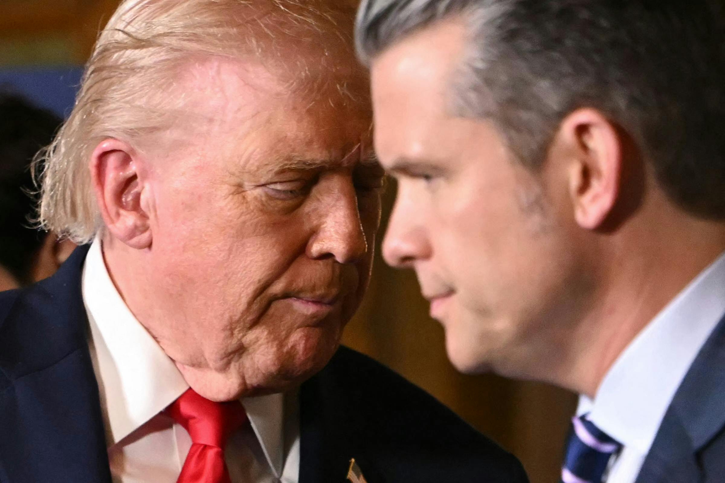 Donald Trump and Pete Hegseth speak closely