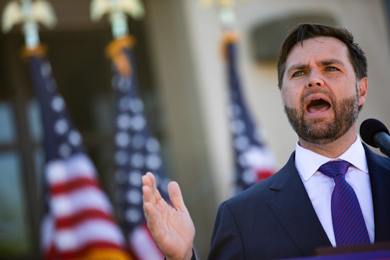 J.D. Vance gestures while speaking at a campaign event