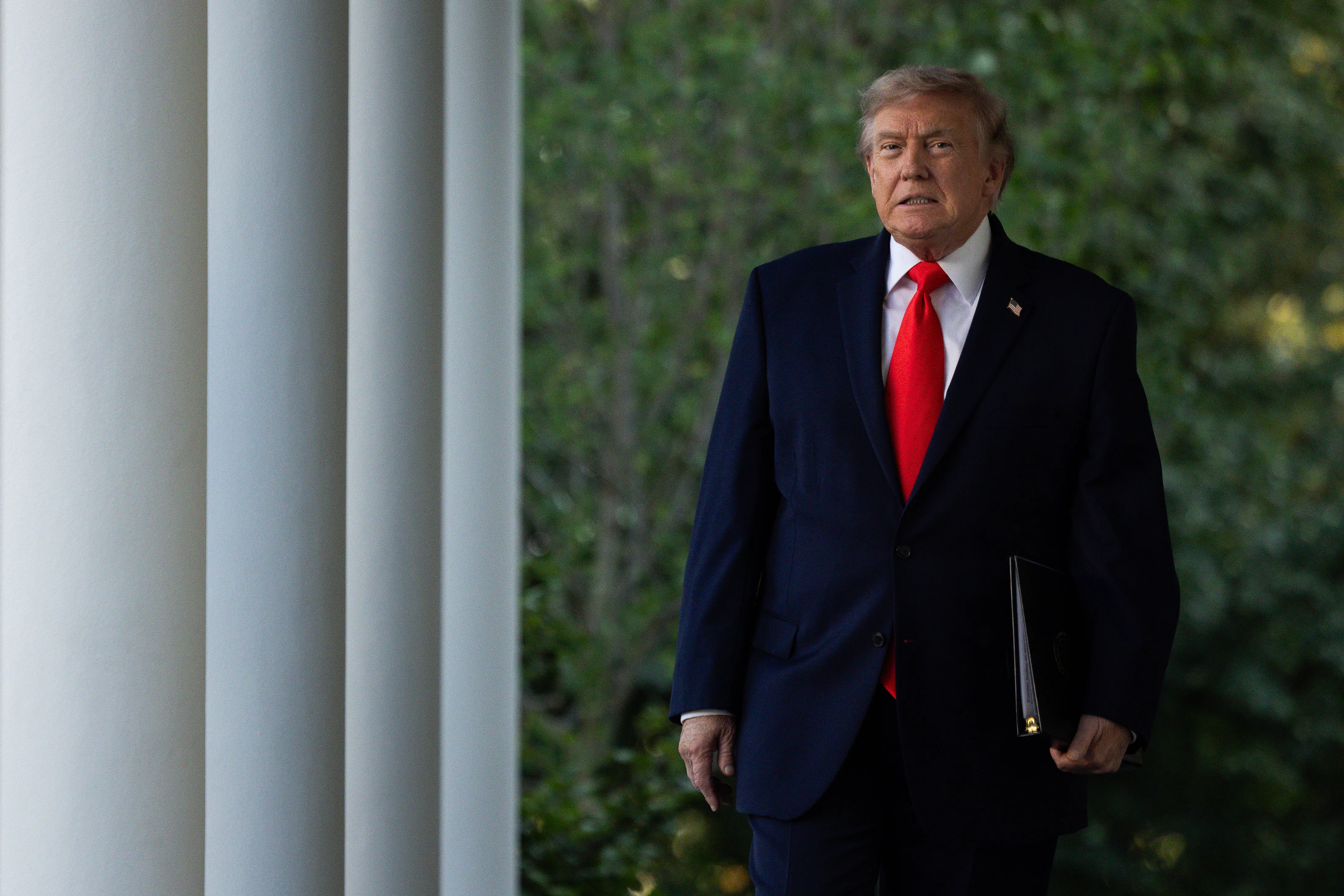 Donald Trump walking in the White House