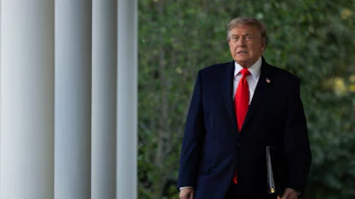 Donald Trump walking in the White House