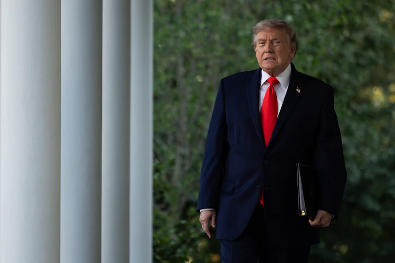 Donald Trump walking in the White House