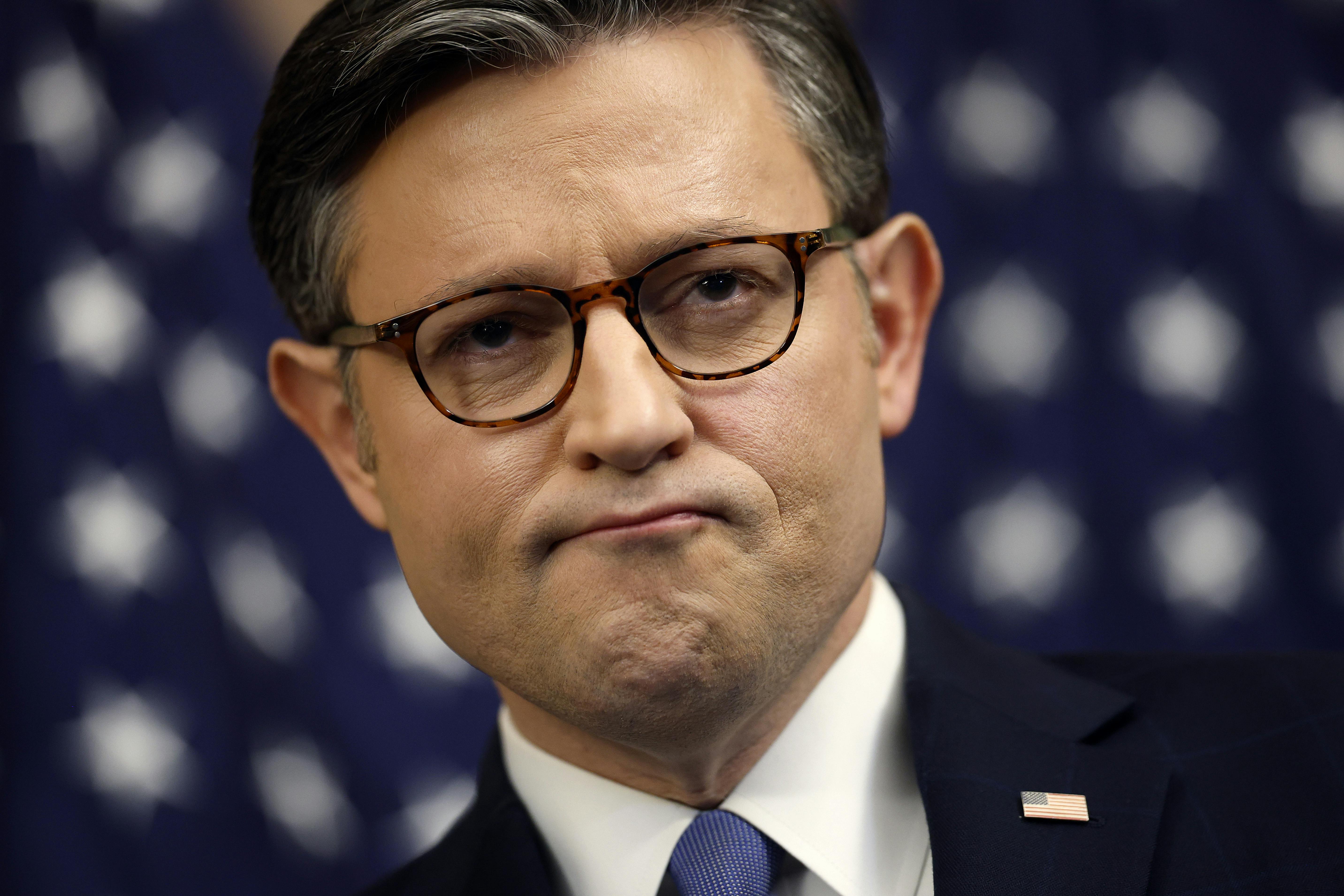 House Speaker Mike Johnson frowns