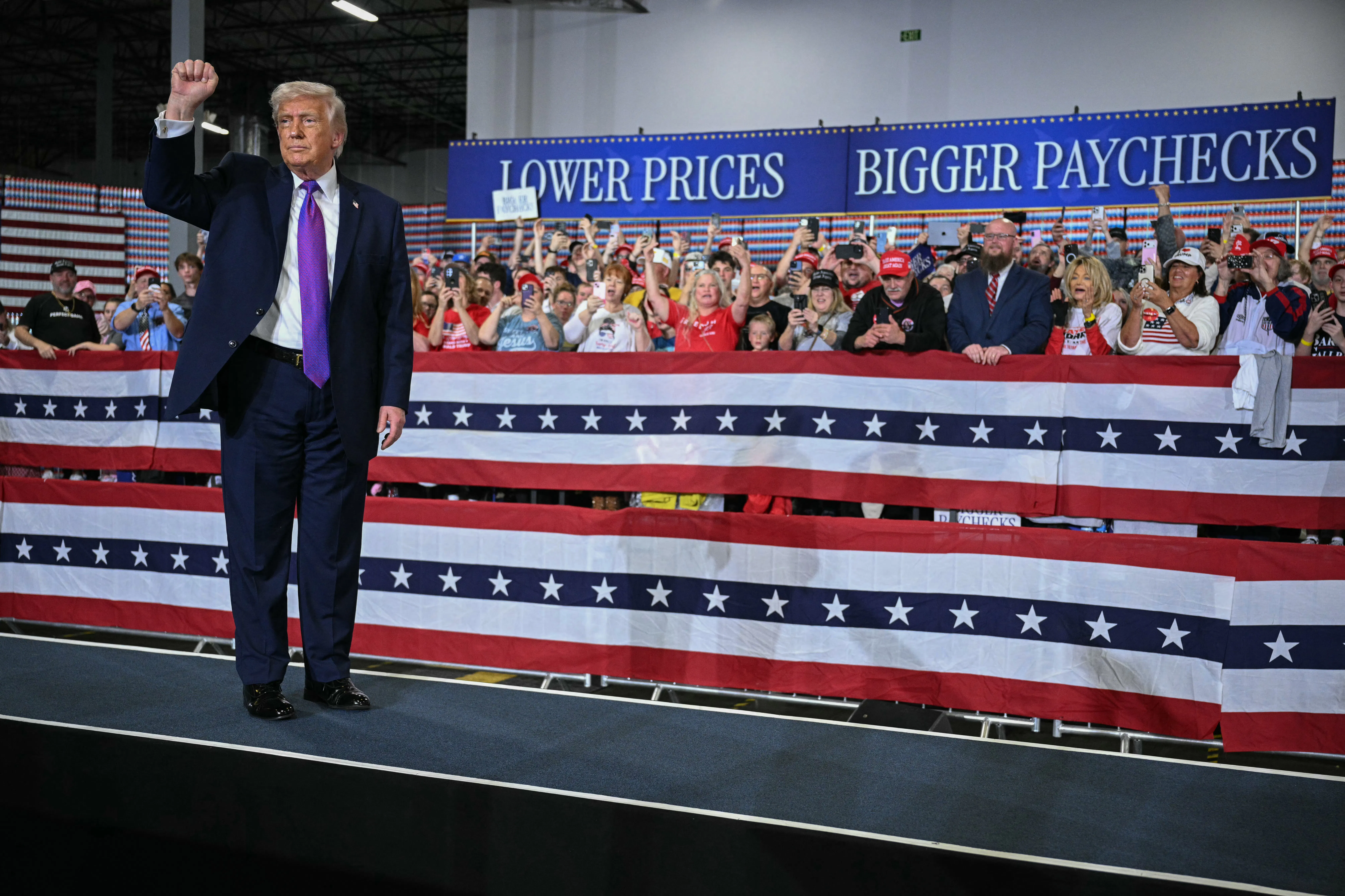 Donald Trump pumps his fist after speaking at Verst Logistics in Hebron, Kentucky.