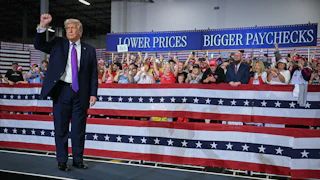 Donald Trump pumps his fist after speaking at Verst Logistics in Hebron, Kentucky.