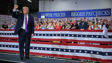 Donald Trump pumps his fist after speaking at Verst Logistics in Hebron, Kentucky.