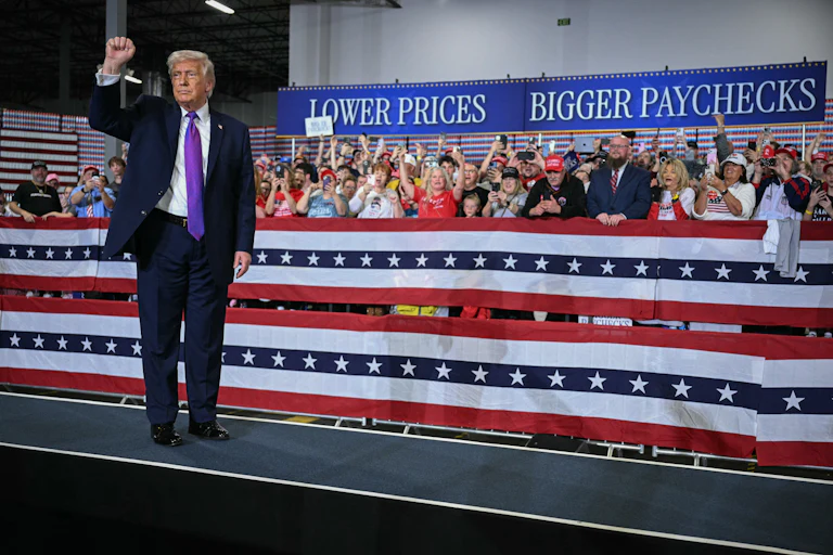 Donald Trump pumps his fist after speaking at Verst Logistics in Hebron, Kentucky.