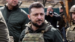 Ukrainian President Volodymyr Zelenskiy stands in the town of Bucha, northwest of the Ukrainian capital Kyiv.