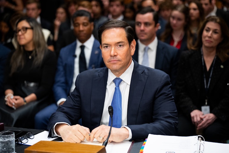 Secretary of State Marco Rubio sits at a table during a Senate hearing