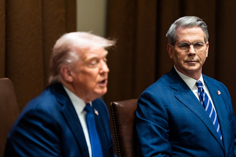 Scott Bessent sits next to Donald Trump, who speaks during a Cabinet meeting