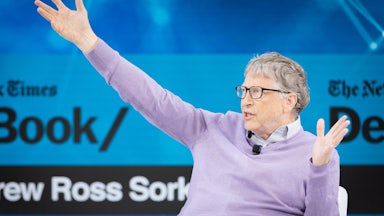 Bill Gates gestures while speaking.