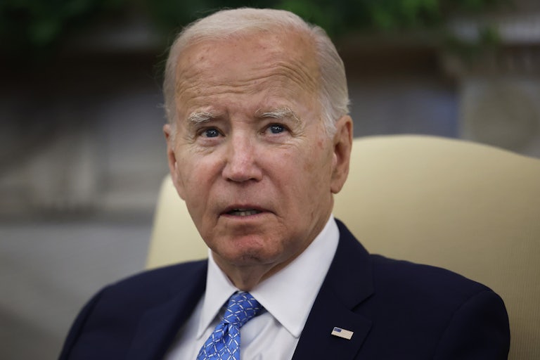 Joe Biden looks worried, glancing off camera