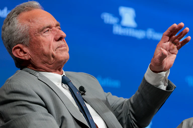 Robert F. Kennedy Jr. gestures with one hand