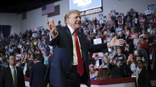 Donald Trump gestures to a crowd.