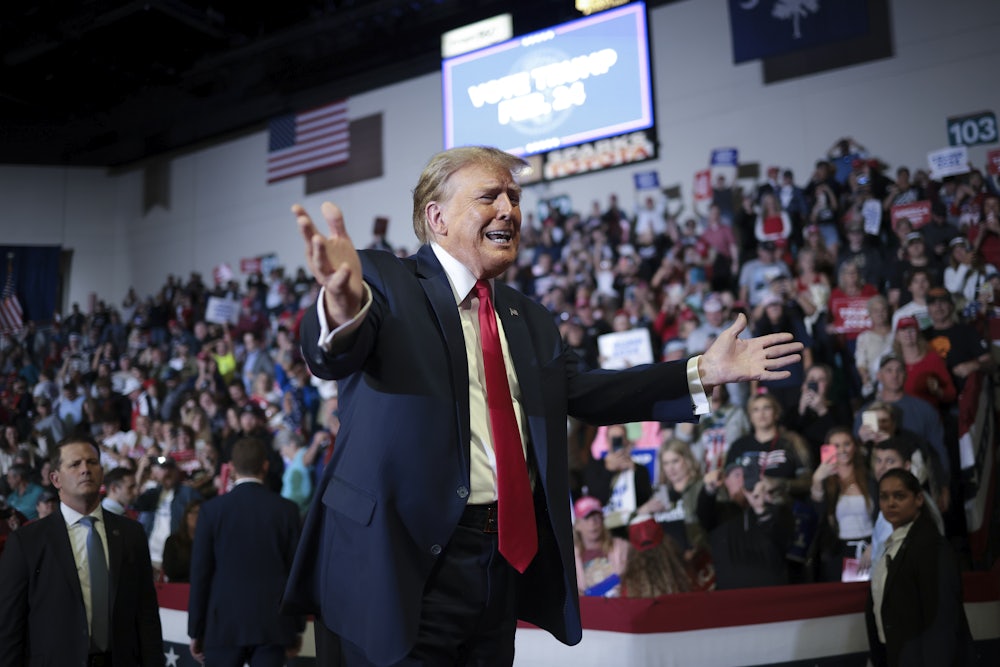 Donald Trump gestures to a crowd.