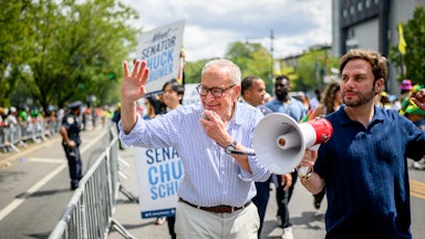 Senate Minority Leader Chuck Schumer marching in a parade in New York