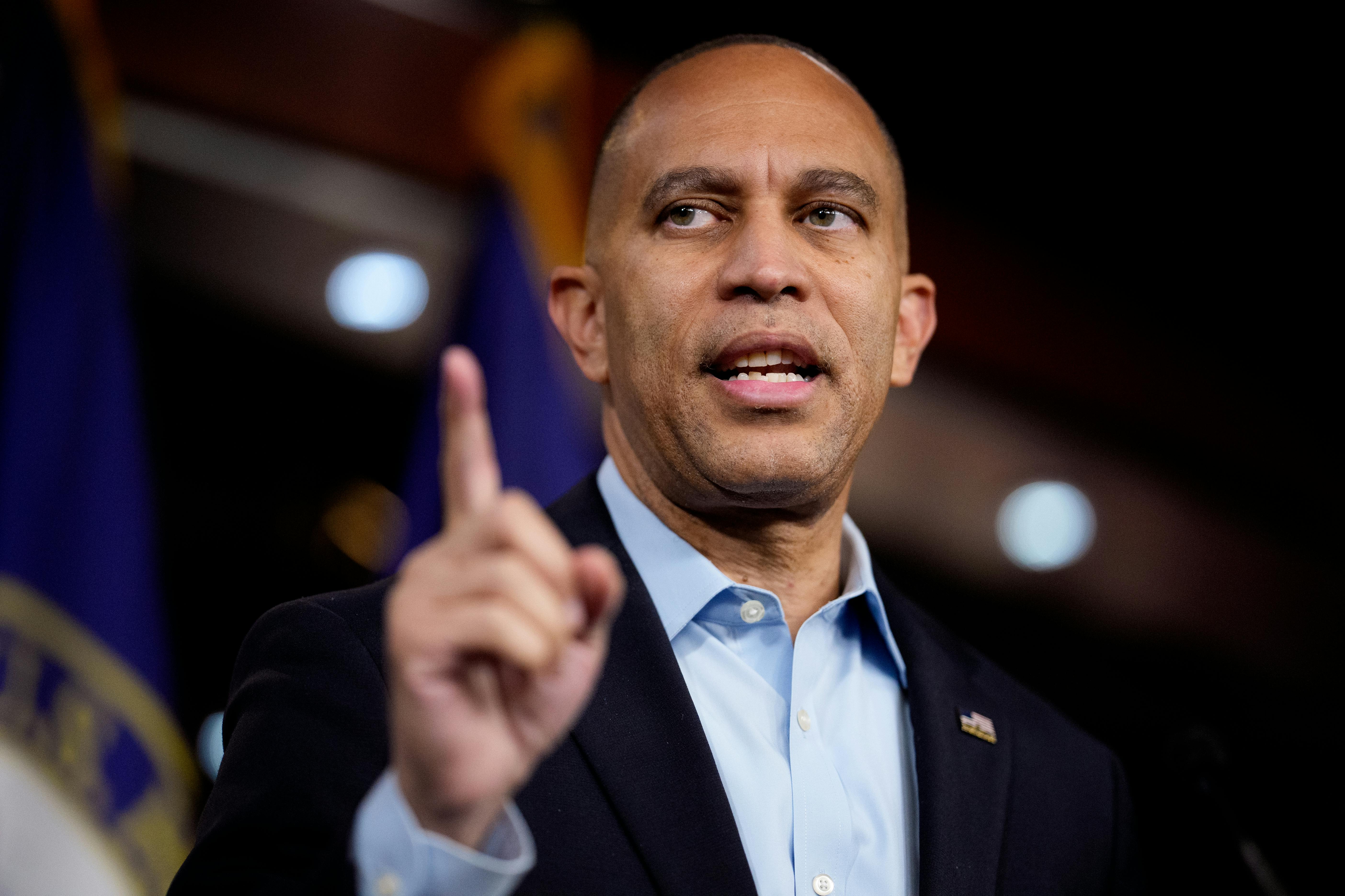House Minority leader Hakeem Jeffries raises an index finger as he speaks in the Capitol.
