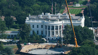 An aerial view of construction of a helipad at the White House