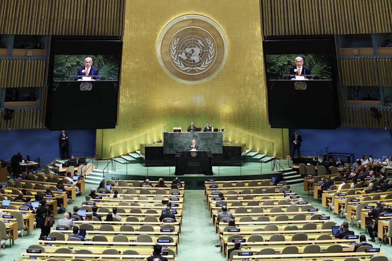 Israeli Prime Minister speaks at the United Nations General Assembly, with dozens of empty seats before him.
