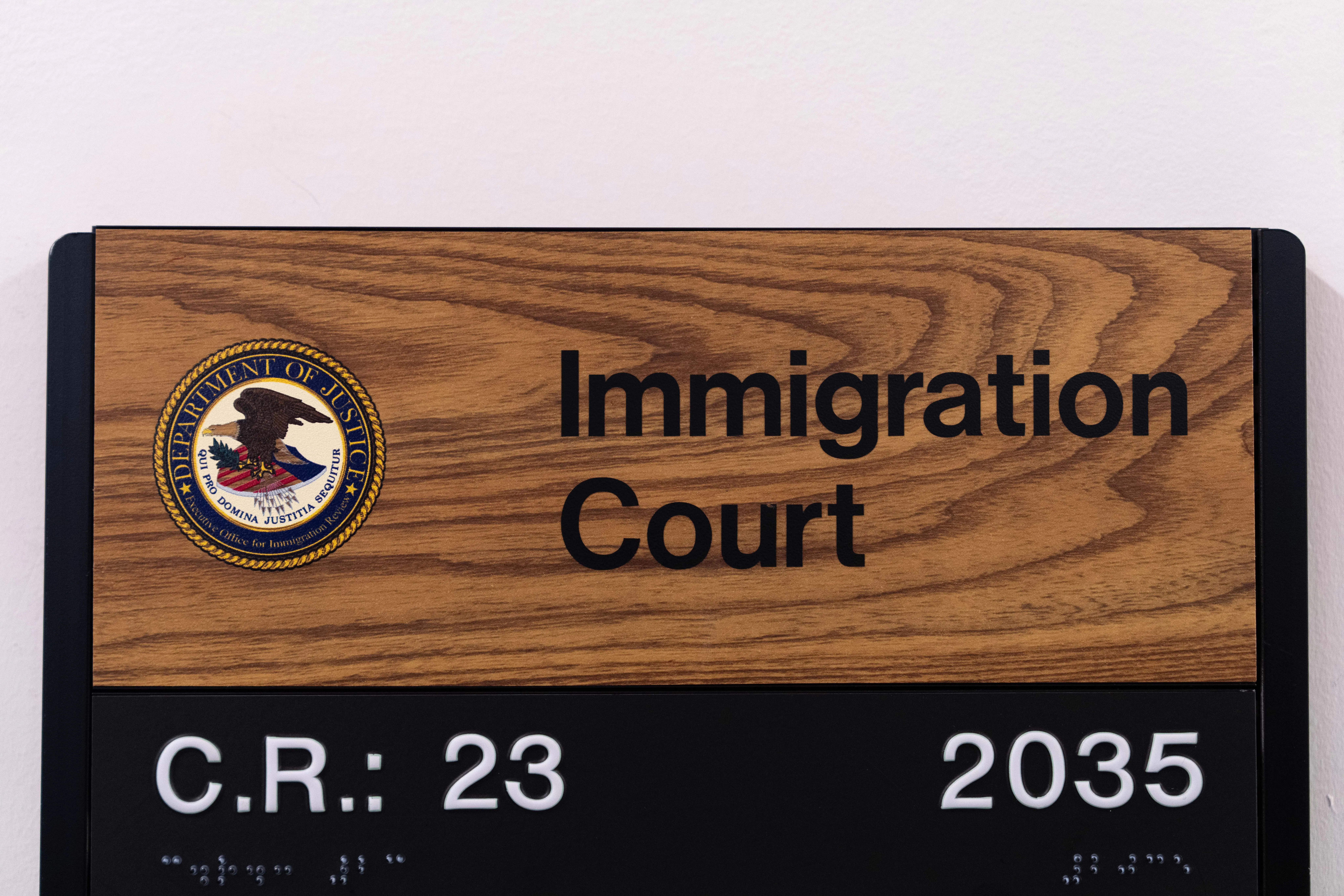 A sign for an immigration courtroom