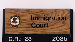 A sign for an immigration courtroom