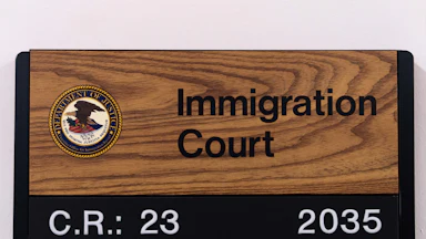 A sign for an immigration courtroom