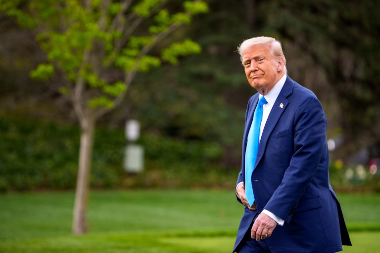Donald Trump walking on the White House lawn