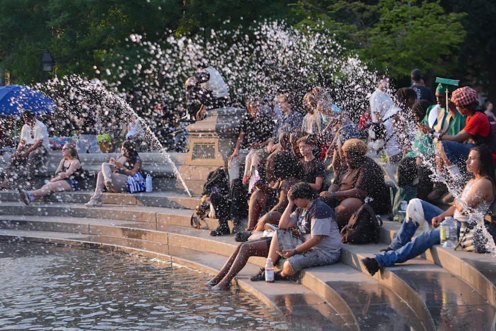 People spend time at Washington Square Park in New York City