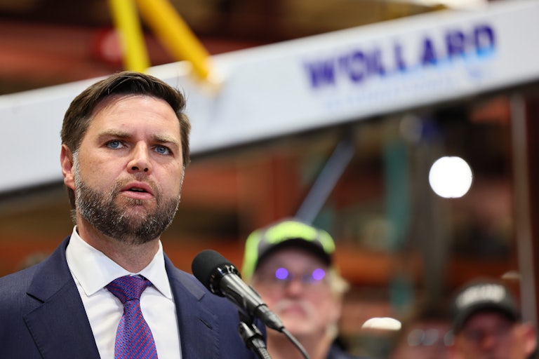J.D. Vance looks surprised while speaking at a mic
