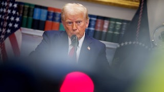 Donald Trump takes a question from a reporter during a news conference in the Roosevelt Room of the White House.